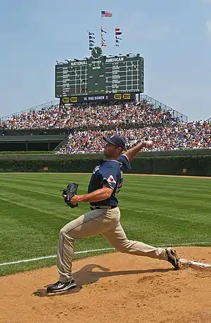 Image 5Chris YoungPhoto credit: Antonio VernonBaseball pitcher Chris Young of the San Diego Padres practices his four-seam fastball before the June 16, 2007 game against the Chicago Cubs at Wrigley Field. During the game, Young hit  Derrek Lee with a pitch, which led to a bench-clearing brawl. Both players were ejected from the game, which ended in a 1–0 victory for San Diego.  The game took place a few weeks before Young was added to his first Major League Baseball All-Star Game roster via the All-Star Final Vote.  The picture also depicts a Wrigley Field bullpen located in playable foul territory.  In the background, the old-fashioned scoreboard and the 2005–06 reconstruction of the centerfield bleachers are visible.March 25 is Opening Day for Major League Baseball.More selected pictures