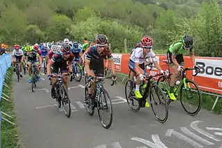 From left to right: Kasia Niewiadoma, Pauline Ferrand-Prévot, Ashleigh Moolman and Sabrina Stultiens leading the peloton on the Côte de La Redoute, at 36&nbsp;km from the finish.