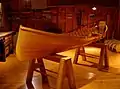 An Adirondack guideboat elevated on sawhorses