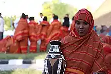 Image 49A Somali woman showing a decorated pottery (from Culture of Somalia)