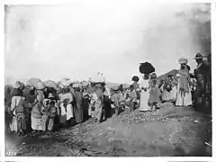 A group of more than 30 Yaqui Indian prisoners being escorted away by Mexican soldiers, Mexico, c. 1910