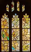 Window 12, resurrection, birds, donkey, four candles at top