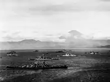 Ships of U.S. Third Fleet and British Pacific Fleet in Sagami Wan, 28 August 1945, preparing for the formal Japanese surrender. Nearest ship is USS&nbsp;Missouri. HMS&nbsp;Duke of York is just beyond, with HMS&nbsp;King George V further in. USS&nbsp;Colorado is in far center distance. Mount Fuji is in the background.