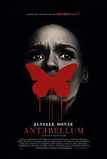 A woman's face. A dripping red painted silouhette of a butterfly covers her mouth.
