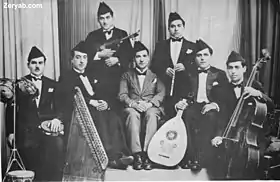Image 20Iraqi music group led by Yusuf Za'arur in Baghdad, wearing the   sidara, ca 1930. (from Music of Iraq)