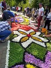 Parishioners during carpet arranging, June 2021
