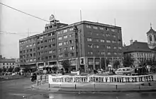 A public square with a rectangular building in the background
