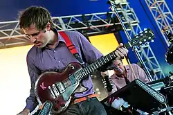 Battles performing live in McCallum Park In 2012. From left to right: Williams, Stanier