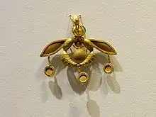 The Bee Pendant, an iconic Minoan jewel; 1700–1600 BC; gold; width: 4.6&nbsp;cm; from Chrysolakkos (gold pit) complex at Malia; Archaeological Museum of Heraklion (Heraklion, Greece)
