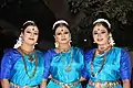 A group of female Bharatanatyam dancers.