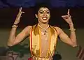 A male Bharatanatyam dancer making an expression.