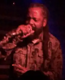 Woods performing in 2023