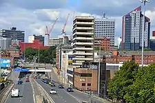The former headquarters (centre) being demolished in August 2016