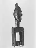 Heddle pulley with female head; late 19th or early 20th century; wood; 20.6 × 5.4 × 4.8&nbsp;cm (81⁄8 × 21⁄8 × 17⁄8 in); Brooklyn Museum