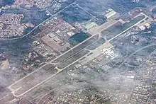 Royal Brunei Air Force Base, Rimba (top left) shares its 3,685 metres (12,090&nbsp;ft) runway with the Brunei International Airport (bottom right), 2016.