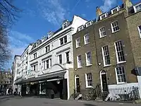 façade of theatre little altered from 1897 one, with the words "Collins' Music Hall" now replaced by "Waterstones"