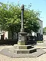 The Canongate Cross in Edinburgh, topped by a cross symbolising the former ecclesiastical burgh
