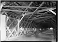 (image 8 of 9)1984Looking up, inside, upper lateral braces, sway braces, roof rafters, collar beams, purlins, and roof sheathing