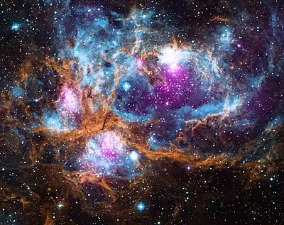 Image 16NGC 6357Photograph credit: NASANGC 6357 is a diffuse nebula in the constellation Scorpius. This composite image of the nebula contains X-ray data from the Chandra X-ray Observatory and the ROSAT telescope (purple), infrared data from the Spitzer Space Telescope (orange), and optical data from the SuperCosmos Sky Survey (blue). Radiation from hot, young stars is energizing the cooler gas in the clouds that surround them. Often known as the Lobster Nebula, the astronomical object has also been termed the Madokami Nebula by fans of the anime Madoka Magica due to its supposed resemblance to the main character. Scientists at the Midcourse Space Experiment prefer the name War and Peace Nebula, because the bright, western part resembles a dove, while the eastern part looks like a skull in infrared images.More selected pictures
