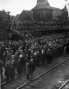 Crowd sending off football team for Harvard game, October 1914
