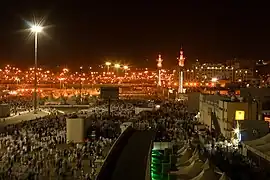 A large crowd of pilgrims heading to the Jamarat Bridge