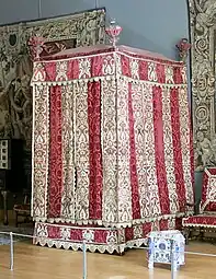 Baroque four-poster bed from the Château d'Effiat; c.1650; natural walnut, chiselled Genoa silk velvet and embroidered silks; 295&nbsp;cm; Louvre