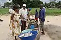 Fishermen selling fish, 2010