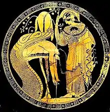 Athena wears the ancient form of the Gorgon head on her aegis, as the huge serpent who guards the golden fleece regurgitates Jason; cup by Douris, Classical Greece, early fifth century&nbsp;BC (Vatican Museum)
