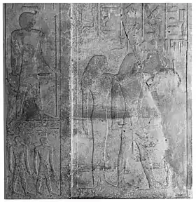 Relief with a man and a woman standing, surrounded by hieroglyphs