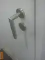 An incorrectly installed door handle in an inn in Stuttgart, Baden-Württemberg, Germany