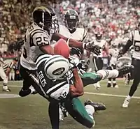 Fletcher breaks up a pass for Laveranues Coles in 2005