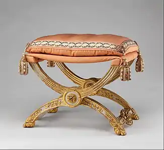 Louis XVI style folding stool (pliant); 1786; carved and painted beechwood, covered in pink silk; 46.4 × 68.6 × 51.4&nbsp;cm; Metropolitan Museum of Art