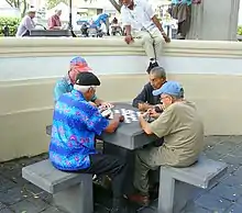 Image 24Four men playing dominoes in San Juan, Puerto Rico (from Culture of Puerto Rico)