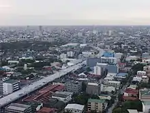 Aerial view of a highway under construction through an urban area