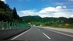 Westbound G56 Hangzhou–Ruili Expressway in the county at the 1,414&nbsp;km (879&nbsp;mi) post