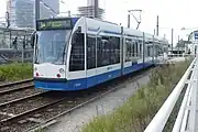 Combino tram at Amsterdam Zuid station. Note that this photo was taken when trams still had their stop inside the station, rather than the current two stops just outside.