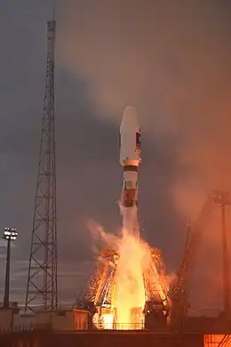 Soyuz launch - a moment of support arms release. Lightning safety tower visible on a left.
