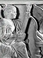 Pandura-type instrument depicted on a Roman sarcophagus dated 3rd century AD.