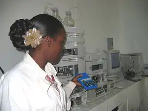 Image 1A technician at the Guyana Food and Drug Department Laboratory in Georgetown, Guyana selecting peanut samples to be tested with new equipment. (from Agriculture in Guyana)
