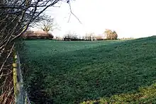 Sloping field where tramway once ran.