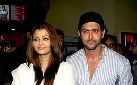 Hrithik Roshan and Aishwarya Rai are looking away from the camera.
