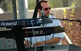 Cummins performing with his shirt on Umphrey's McGee in 2007