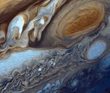 Image 9Great Red SpotPhoto credit: Voyager 1False-color detail of Jupiter's atmosphere, imaged by Voyager 1, showing the Great Red Spot and a passing white oval. The wavy cloud pattern to the left of the Red Spot is a region of extraordinarily complex and variable wave motion. To give a sense of Jupiter's scale, the white oval storm directly below the Great Red Spot is approximately the same diameter as Earth.More selected pictures