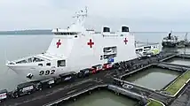 The Indonesian Navy personnels and crews loading the humanitarian aid into KRI dr. Radjiman Wedyodiningrat (992) at Indonesian 2nd Fleet Command (Koarmada II) dock, Surabaya, East Java. (28/11/2023)