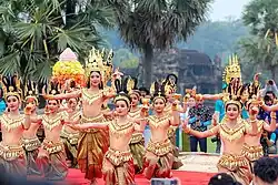 Khmer dancers performing in front of Angkor Wat in traditional attire
