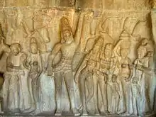 A relief on the rock face of Krishna lifting Govardhan Hill in the Krishna Mandapa
