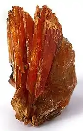 Leiteite, a zinc arsenate, colored umber-red by inclusions of Ludlockite, a lead arsenate. Tsumeb is the type locality for both species. Size: 2.8 x 1.8 x 1.2&nbsp;cm.