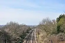 View of a railway in a cutting, with trees