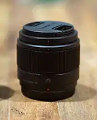 The Panasonic Lumix G 25mm F1.7 ASPH lens with its lens cap on