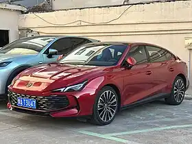 Front three-quarter view of a front-engined four-door car.